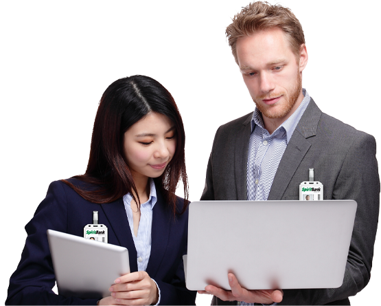 Male and female looking at computer